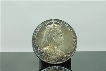 Kif għandi nżomm il-badge tiegħi